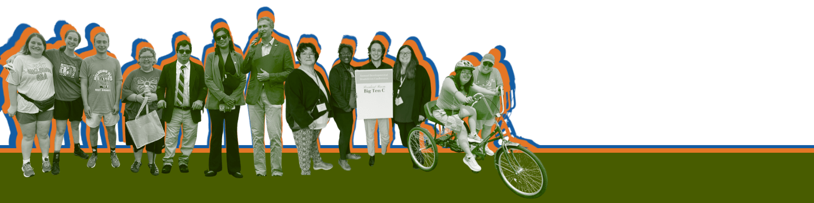 Picnic goers sit at tables under the food tent during our ADA Celebration.